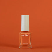 Le vernis à ongles orange et sans produit chimique d'OrelKa